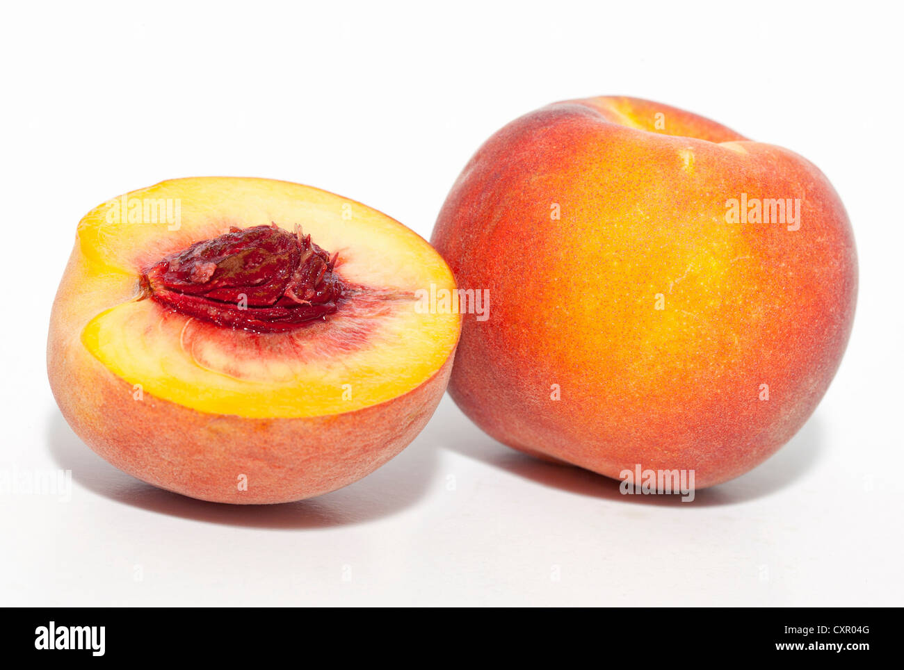 Whole and half peach Stock Photo