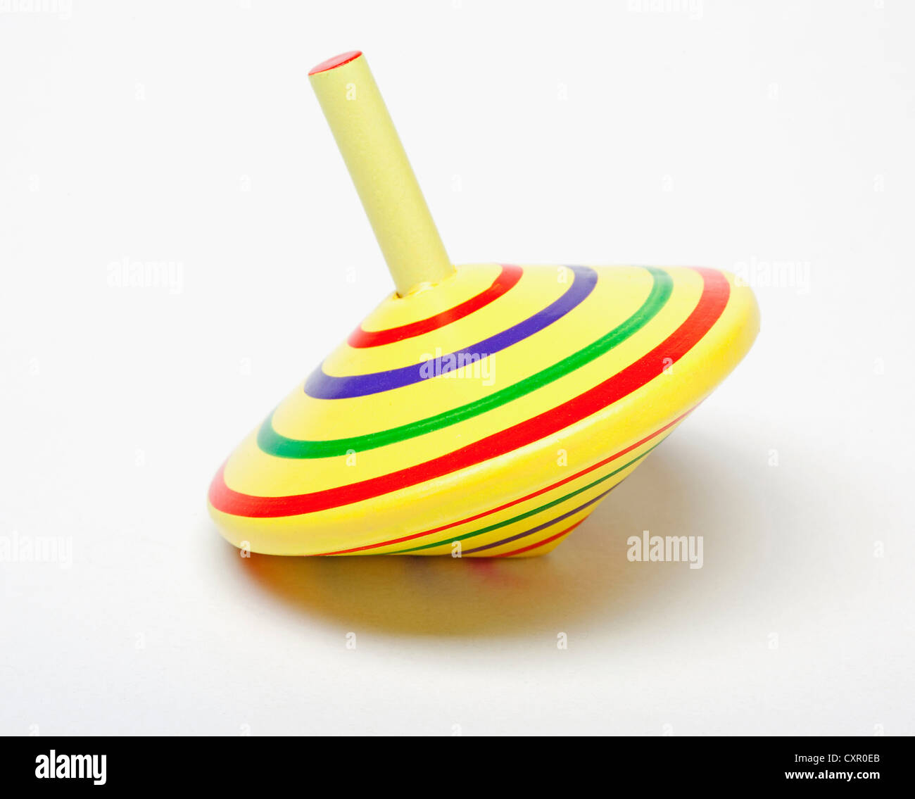 Yellow spinning top Stock Photo