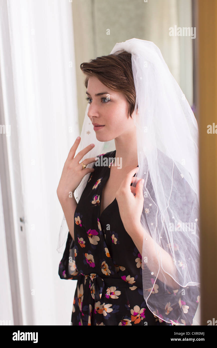 Young woman wearing a bridal veil Stock Photo - Alamy