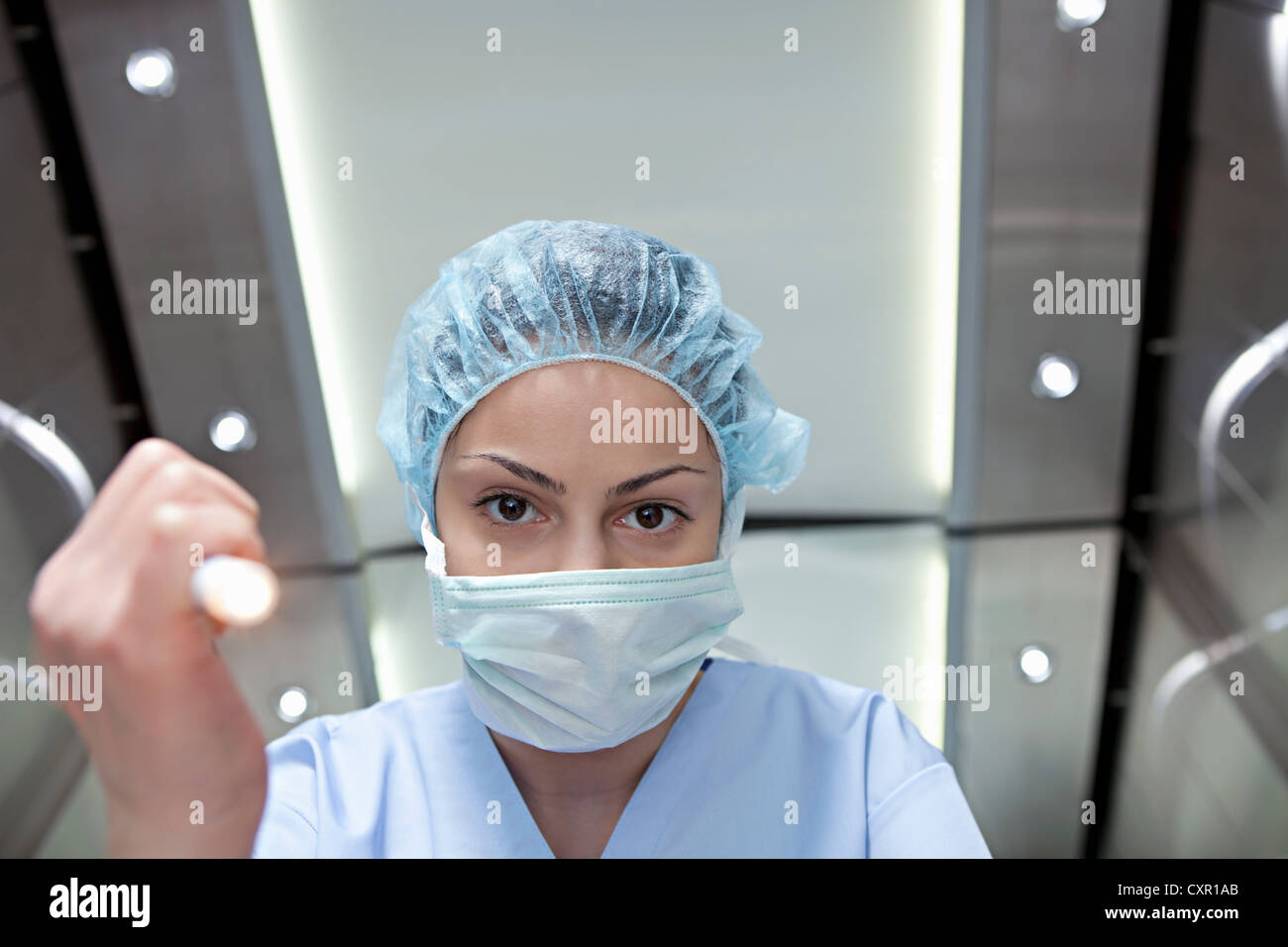Surgeon shining torch, personal perspective Stock Photo