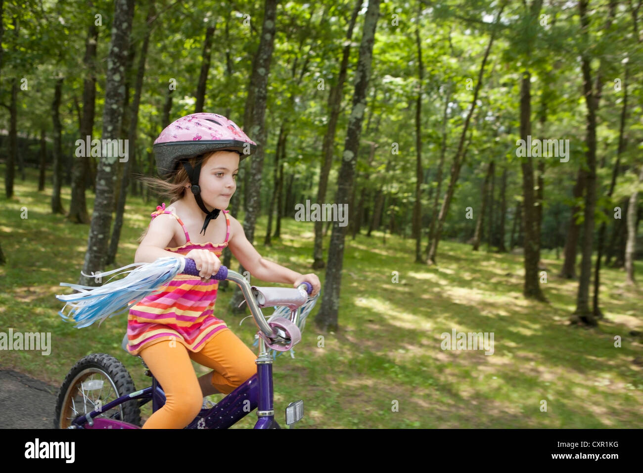 Girl cycling Stock Photo