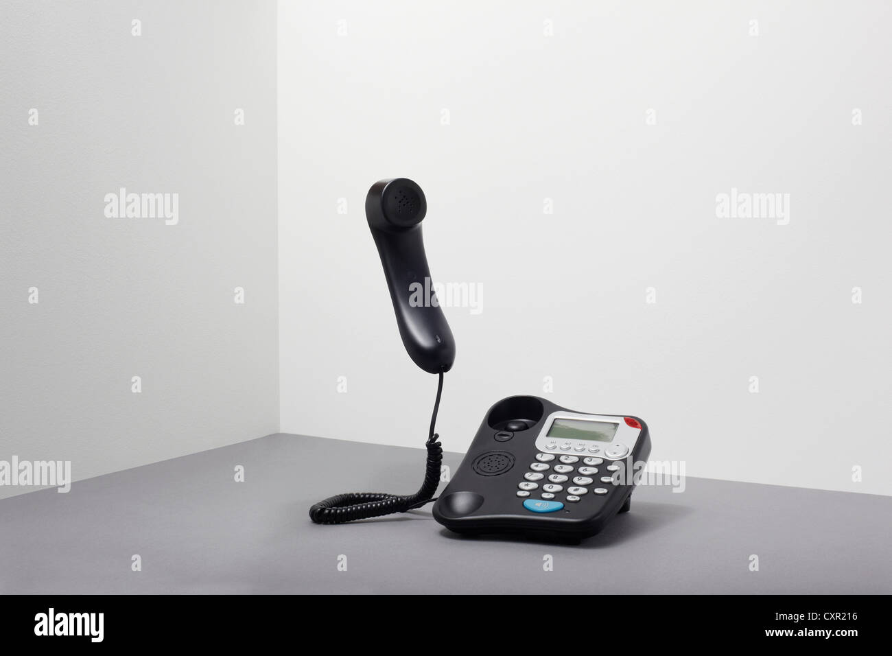Landline office phone off the hook Stock Photo