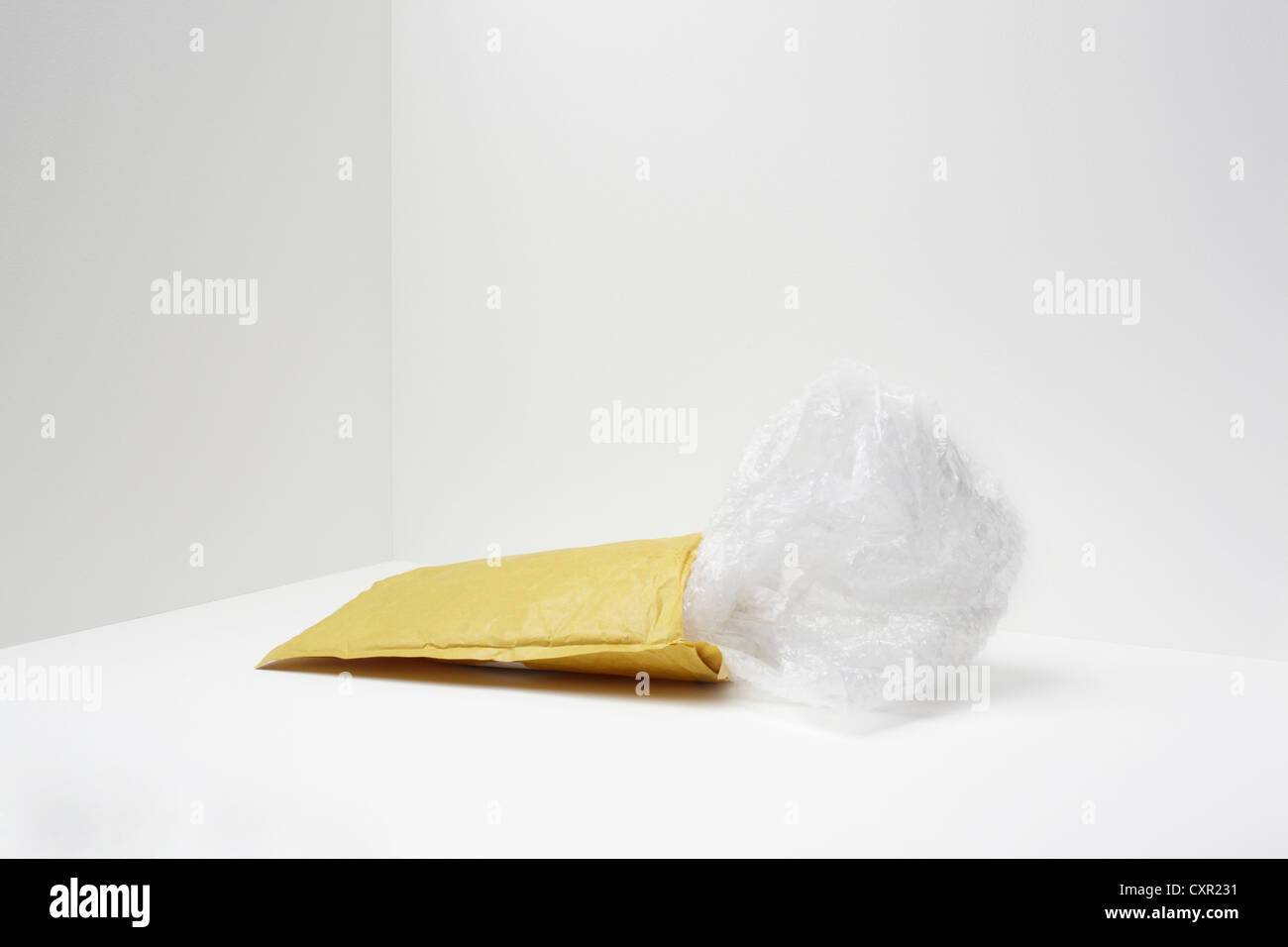 Padded envelope with plastic coming out Stock Photo