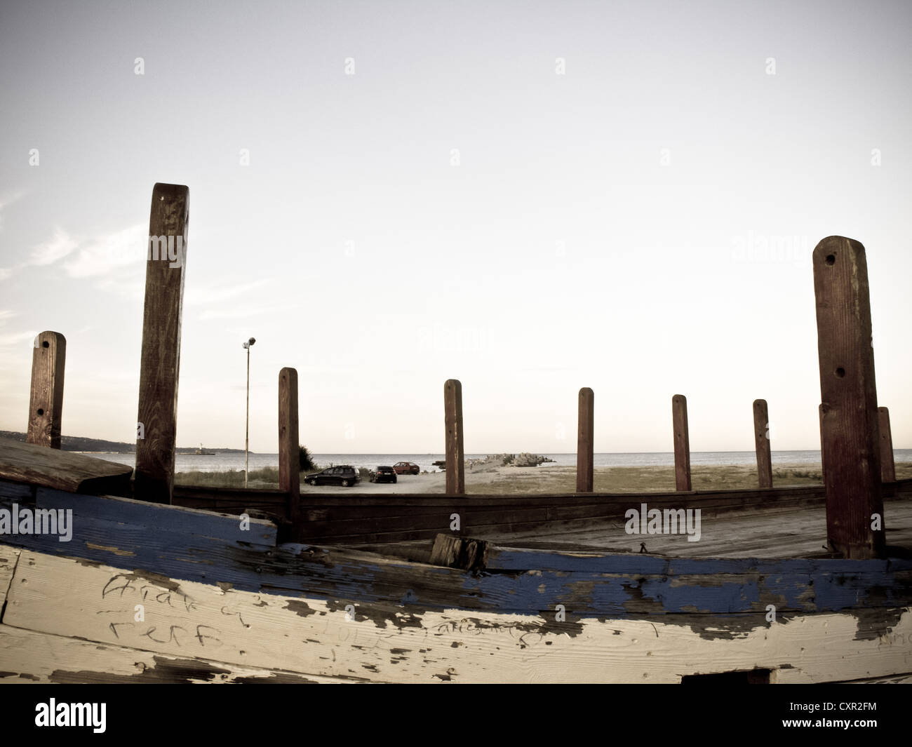 Wreck of abandoned fishing boat on sunset Stock Photo - Alamy