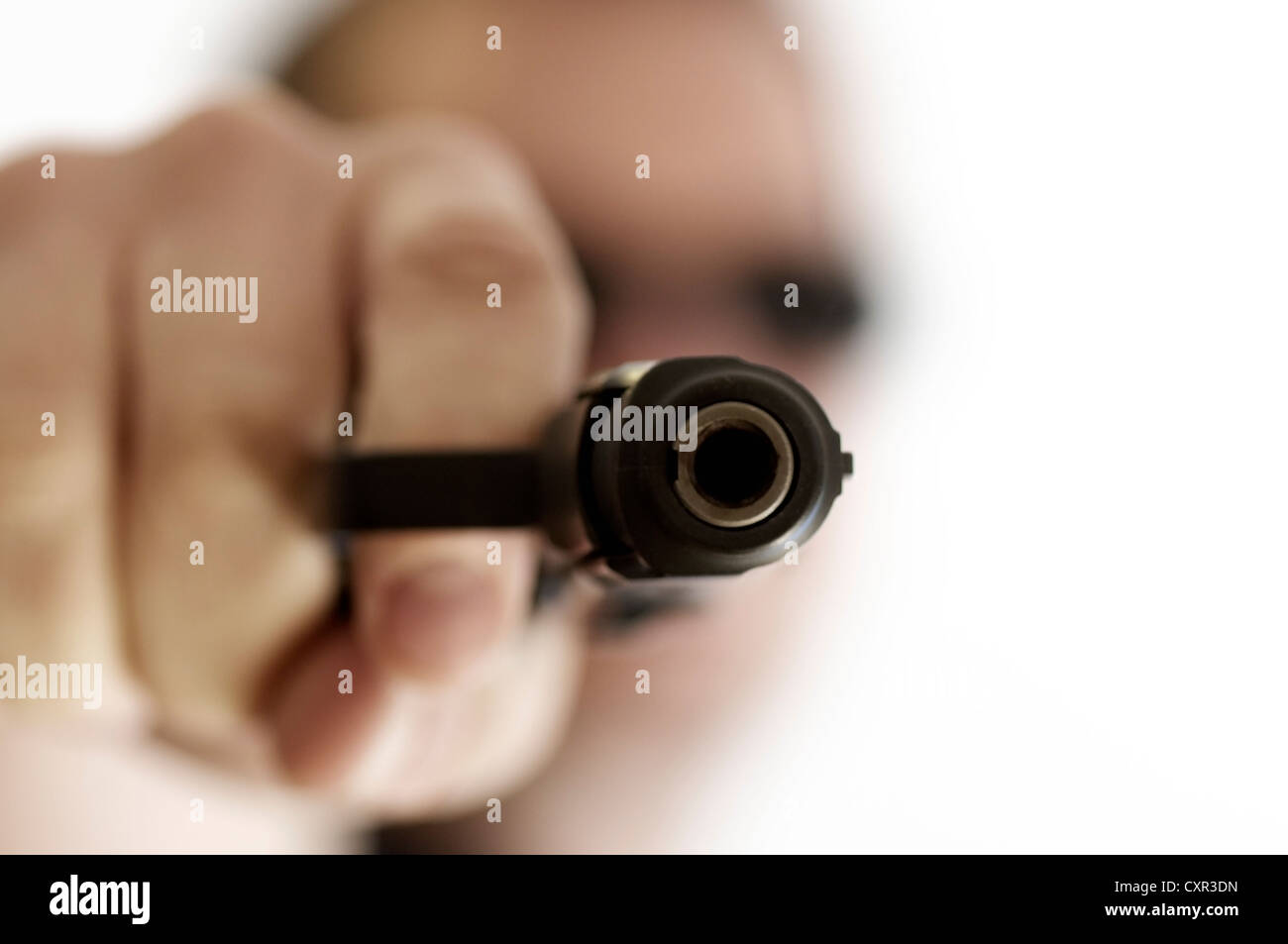 Gun being pointed at the viewer. Stock Photo