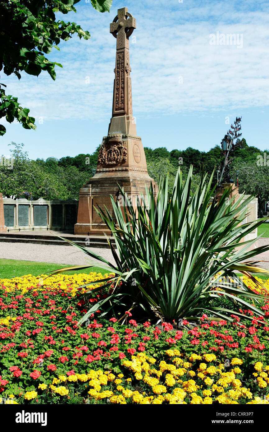 A War Memorial in Inverness, Scotland, set in a colourful ,floral garden of remembrance. Stock Photo