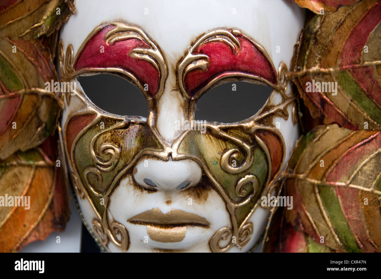 A display of Masquerade Ball Masks and Venetian Masks on sale in the town of Bardolino, a resort/fishing port in the red wine-growing region on the ea Stock Photo