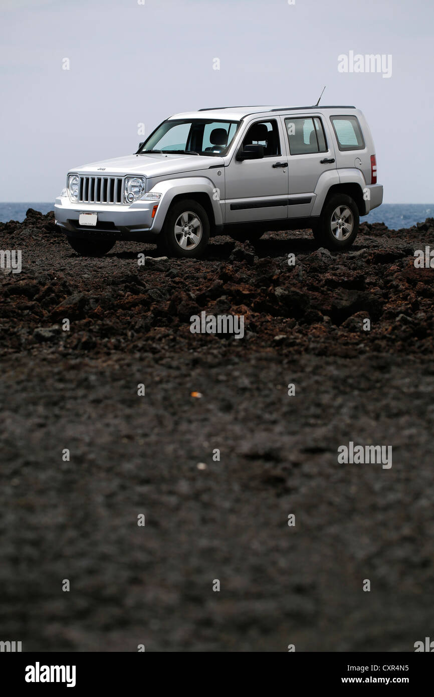 Jeep, four-wheel vehicle on lava road, Big Island, Hawaii, USA Stock Photo