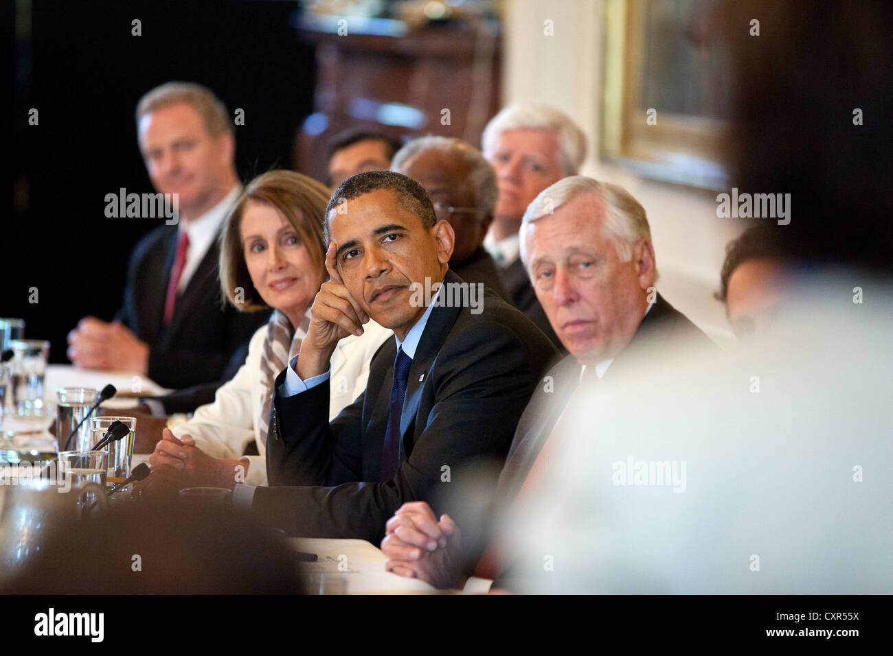US President Barack Obama meets with the Democratic House Caucus June 2, 2011 in the East Room of the White House. Flanking the President are Minority Leader Nancy Pelosi, left, and Rep. Steny Hoyer, Minority Whip. Stock Photo