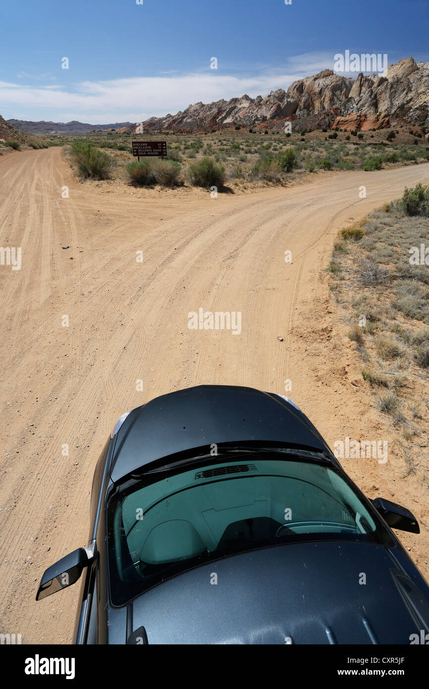 Car on a dirt road, Notom-Bullfrog Road, Capitol Reef National Park, Strike Valley and Waterpocket Fold, Utah, USA Stock Photo