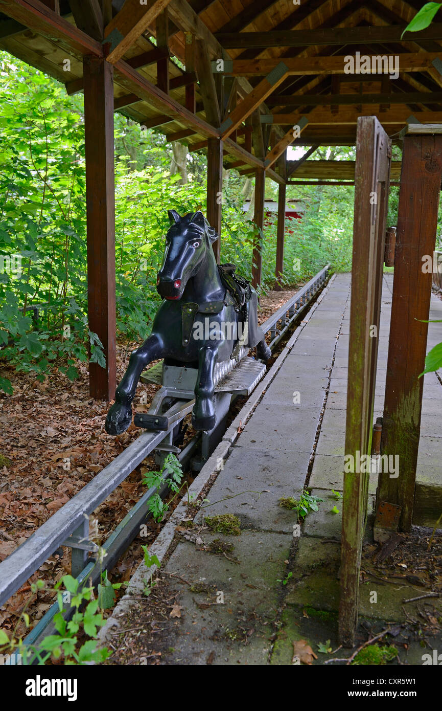 Morbid charm of an abandoned funfair ride in the former Spreepark Berlin amusement park, formerly known as Kulturpark Stock Photo