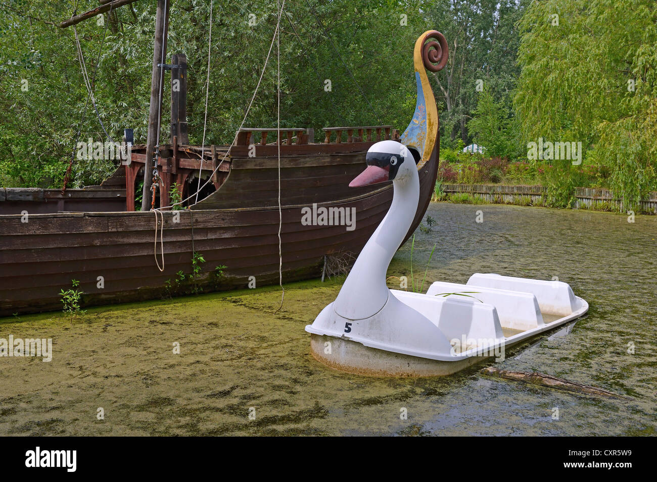 Morbid charm of a swan gondola, abandoned Spreepark Berlin amusement park, formerly known as Kulturpark Plaenterwald in the Stock Photo