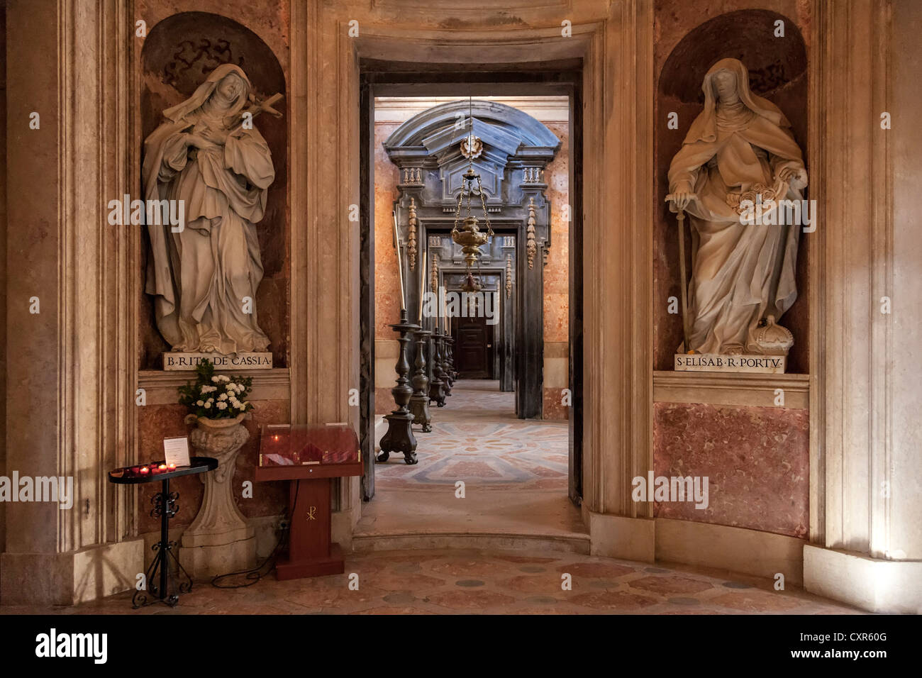 St Rita of Cascia and St Elisabeth of Portugal. Italian baroque statues in the Basilica of the Mafra National Palace, Portugal. Stock Photo