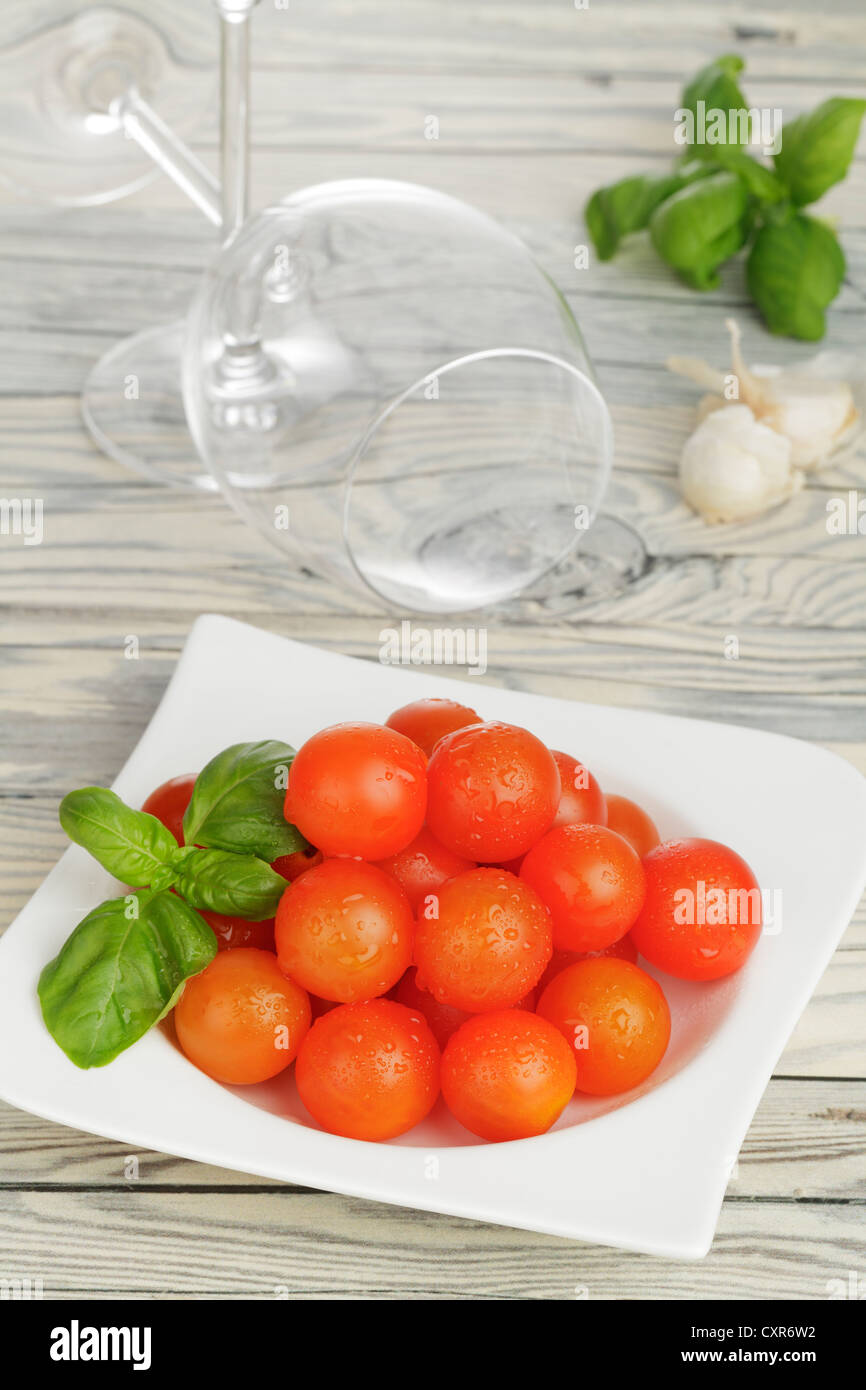 Cherry tomatoes, basil and garlic Stock Photo Alamy