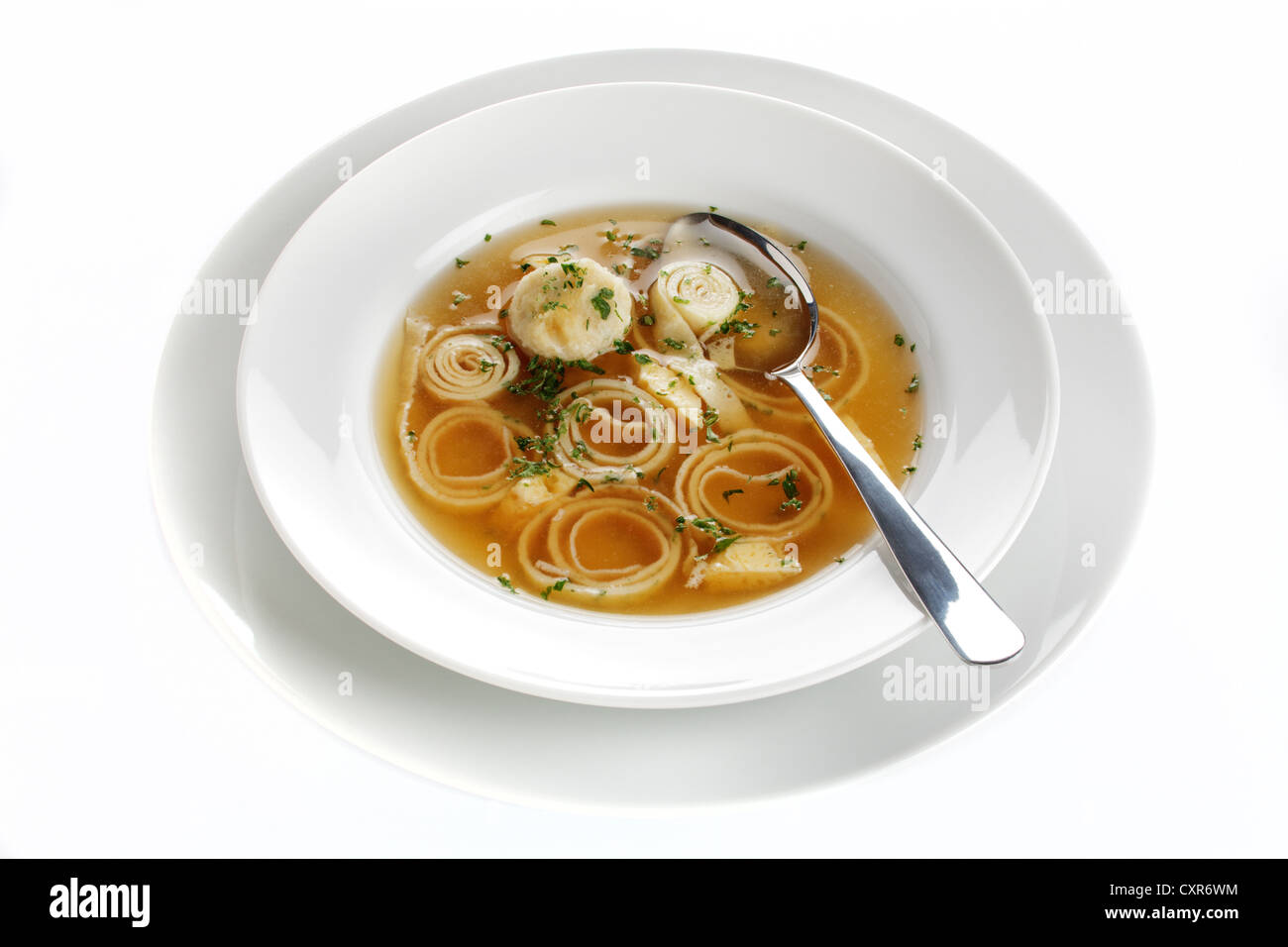 Wedding soup, beef stock with dumplings, sliced pancakes and egg Stock Photo