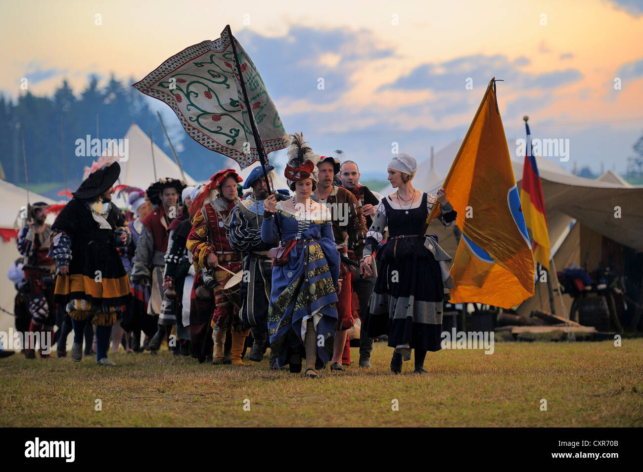 Platoon of lansquenets, foot soldiers marching at sunset, historical re-enactment, Landsknecht Hurra 2012, Mittelberg Stock Photo