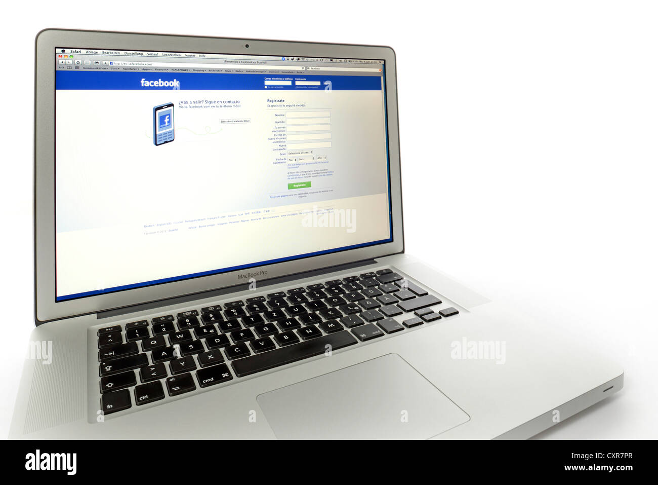 Spanish language version of Facebook, social networking website displayed on the screen of an Apple MacBook Pro Stock Photo