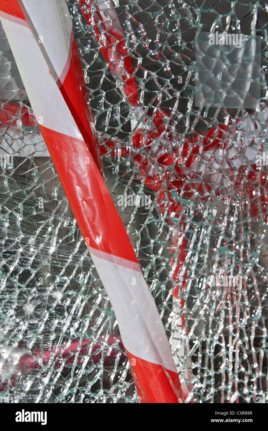 Barrier tape, broken store window, vandalism Stock Photo