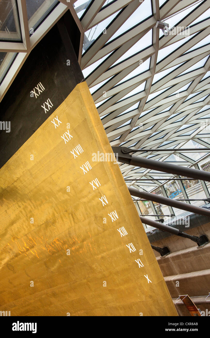 The golden stern of the Cutty Sark an original tea clipper vessel from the 1800's, showing roman numeration on the bow scale Stock Photo