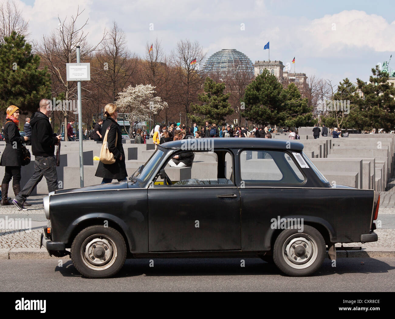 Old black Trabant car, parked in front of the Holocaust Memorial, Memorial to the Murdered Jews of Europe, Berlin Stock Photo