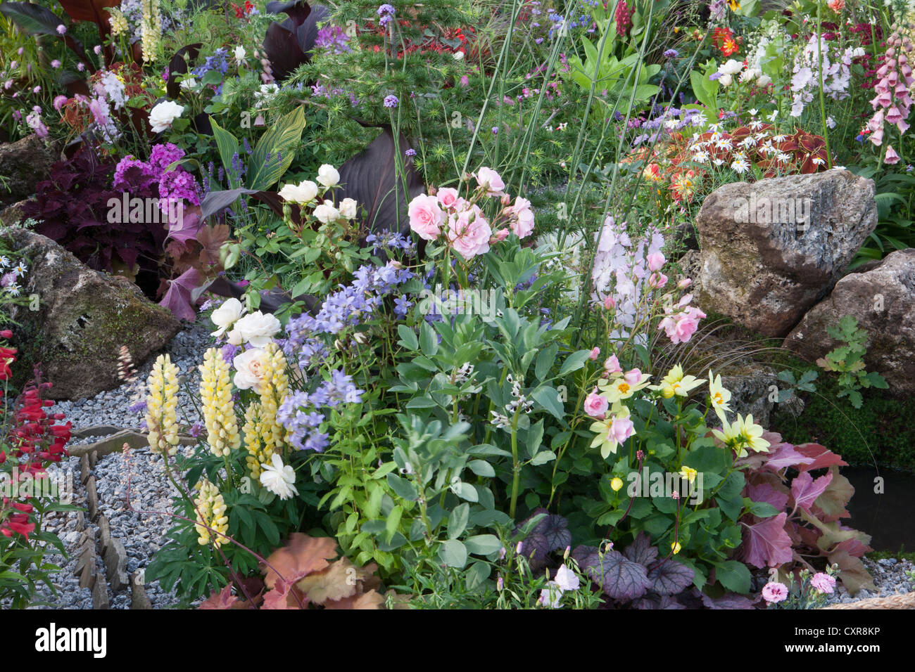 colourful garden rockery flower border uk Stock Photo