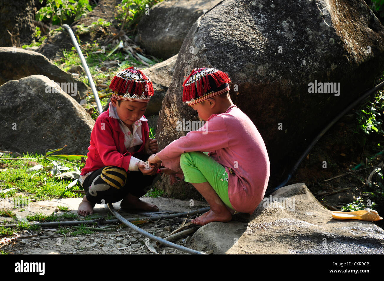 Boys at play, member of the Red Dao ethnic minority, in the countryside near Sa Pa, Northern Vietnam, Vietnam, Southeast Asia Stock Photo