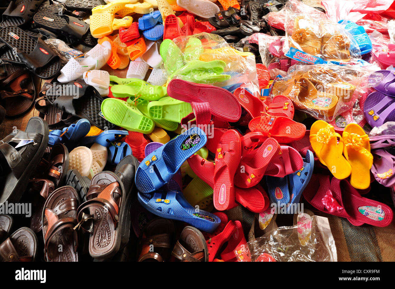 Colourful plastic sandals for sale at a market, Can Cau, Northern Vietnam, Vietnam, Southeast Asia, Asia Stock Photo