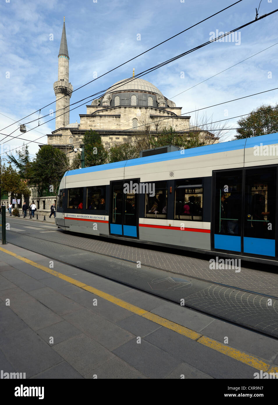 Modern tram in front of the Molla Fenari Mosque, Istanbul, Turkey, Europe, PublicGround Stock Photo