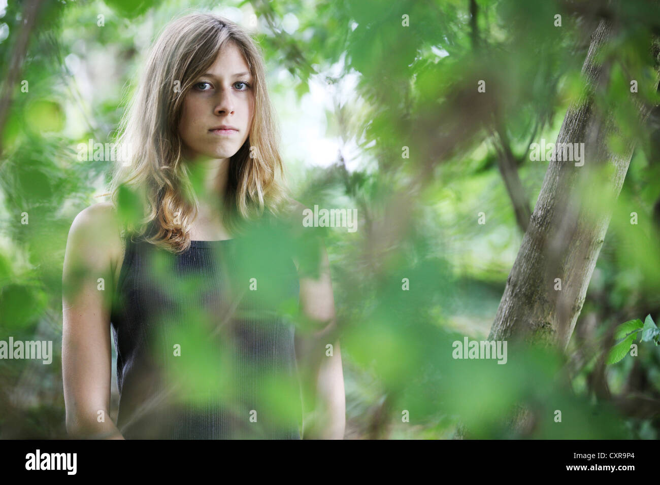 Young woman, portrait, in natural surroundings Stock Photo