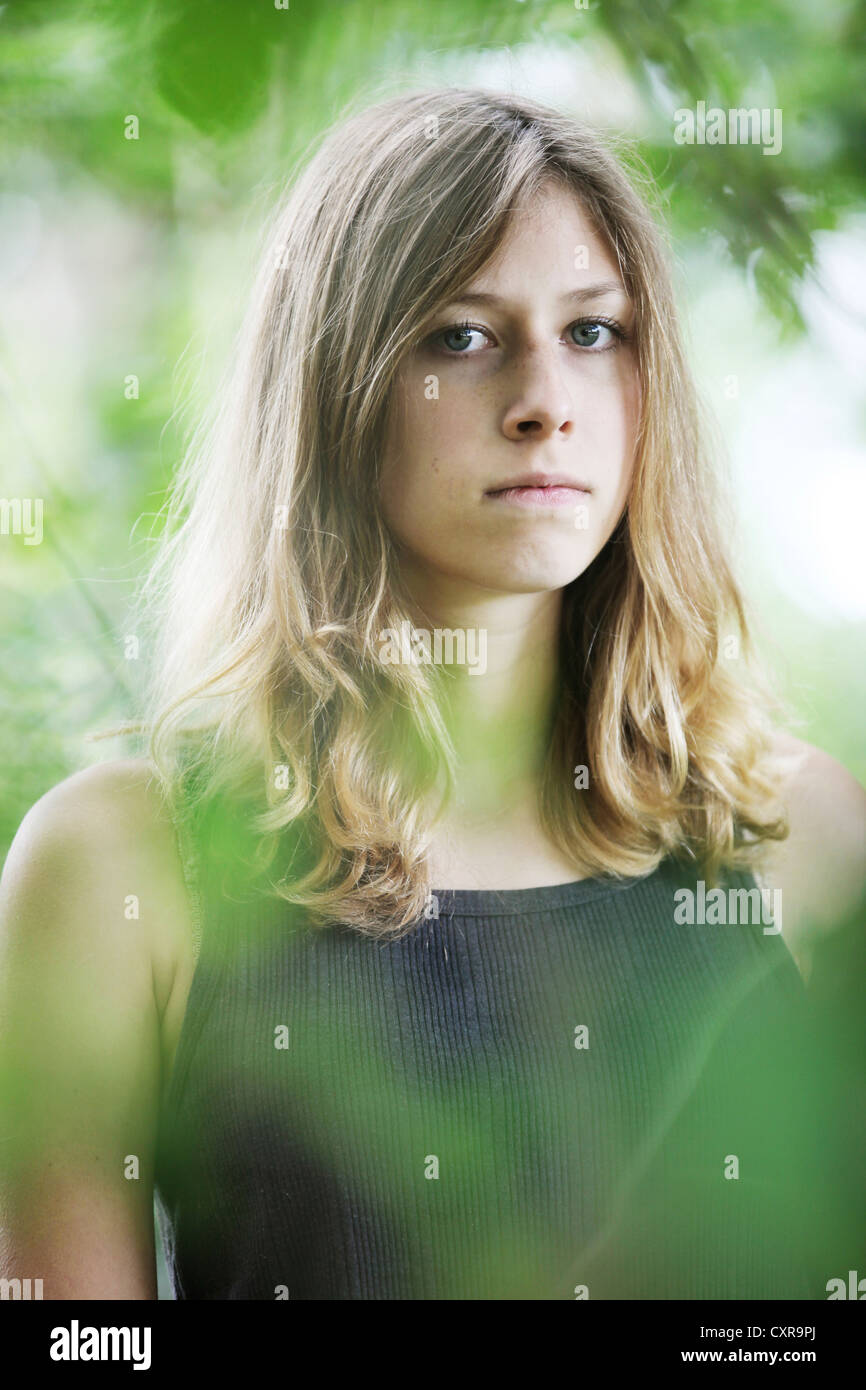 Young woman, portrait, in natural surroundings Stock Photo