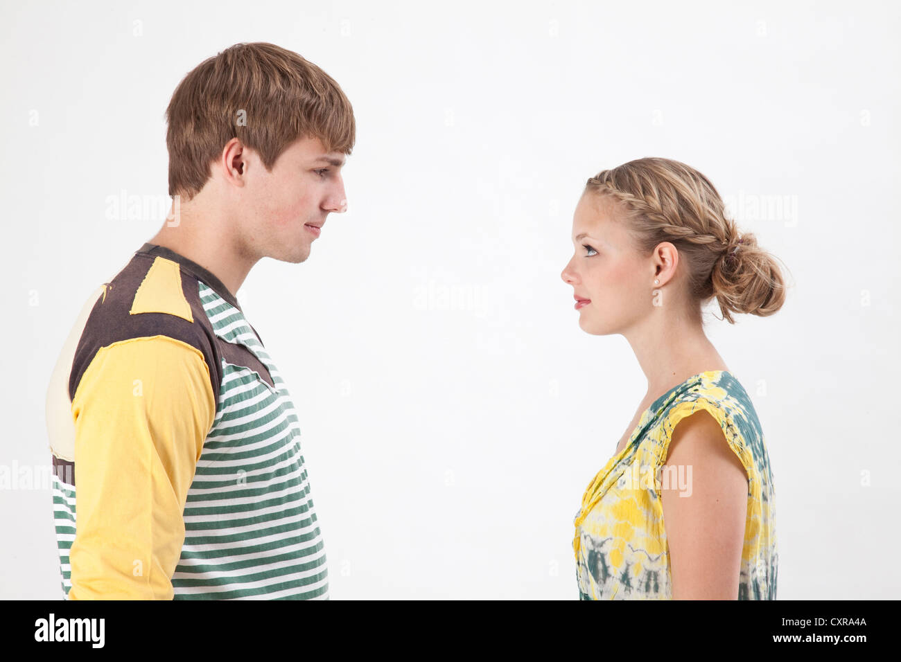 Young couple facing each other Stock Photo Alamy