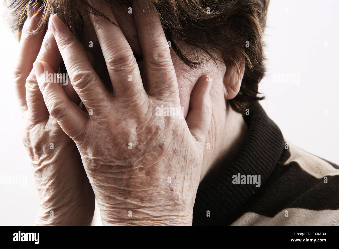 Elderly woman looking distressed Stock Photo
