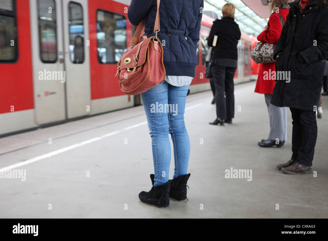 Waiting passengers at Cologne Central Railway Station, Cologne, North Rhine-Westphalia, Germany, Europe Stock Photo