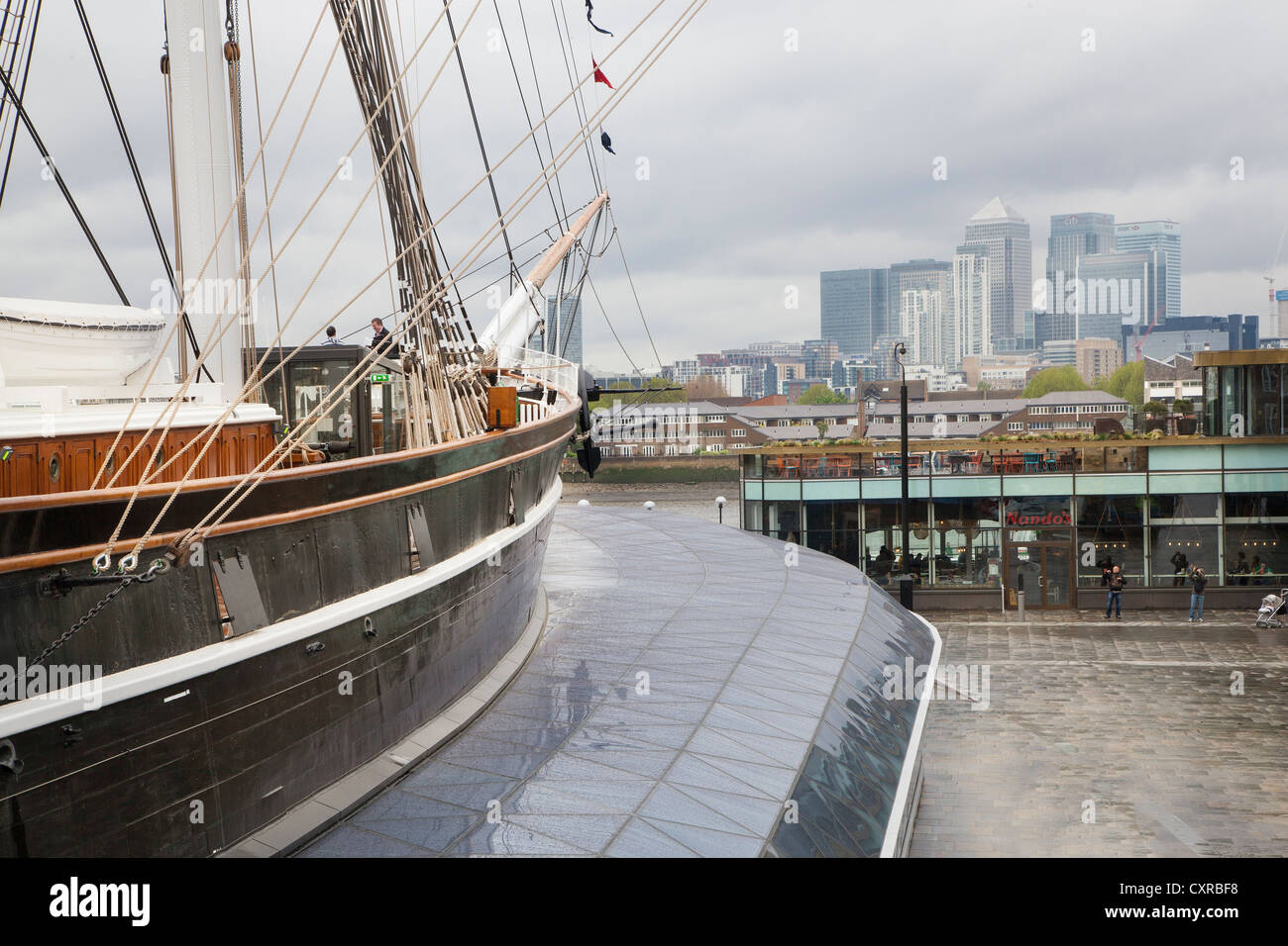The Cutty Sark an historic tea clipper from the 1800's photographed in dry dock at Greenwich with city view Stock Photo