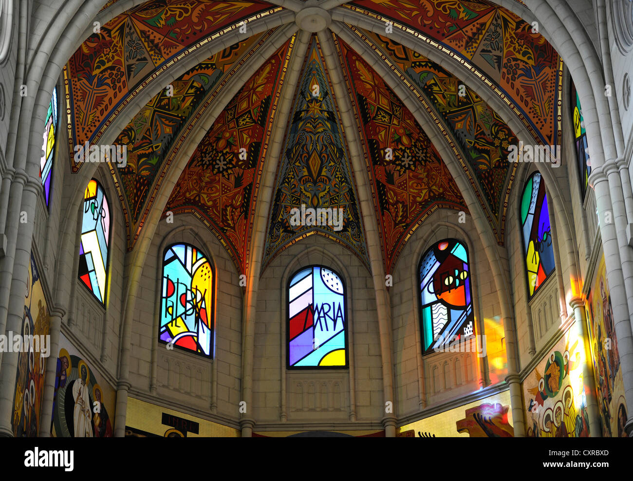 Modern stained-glass windows and the painted ceiling of the dome, interior view, Almudena Cathedral, Santa María la Real de La Stock Photo