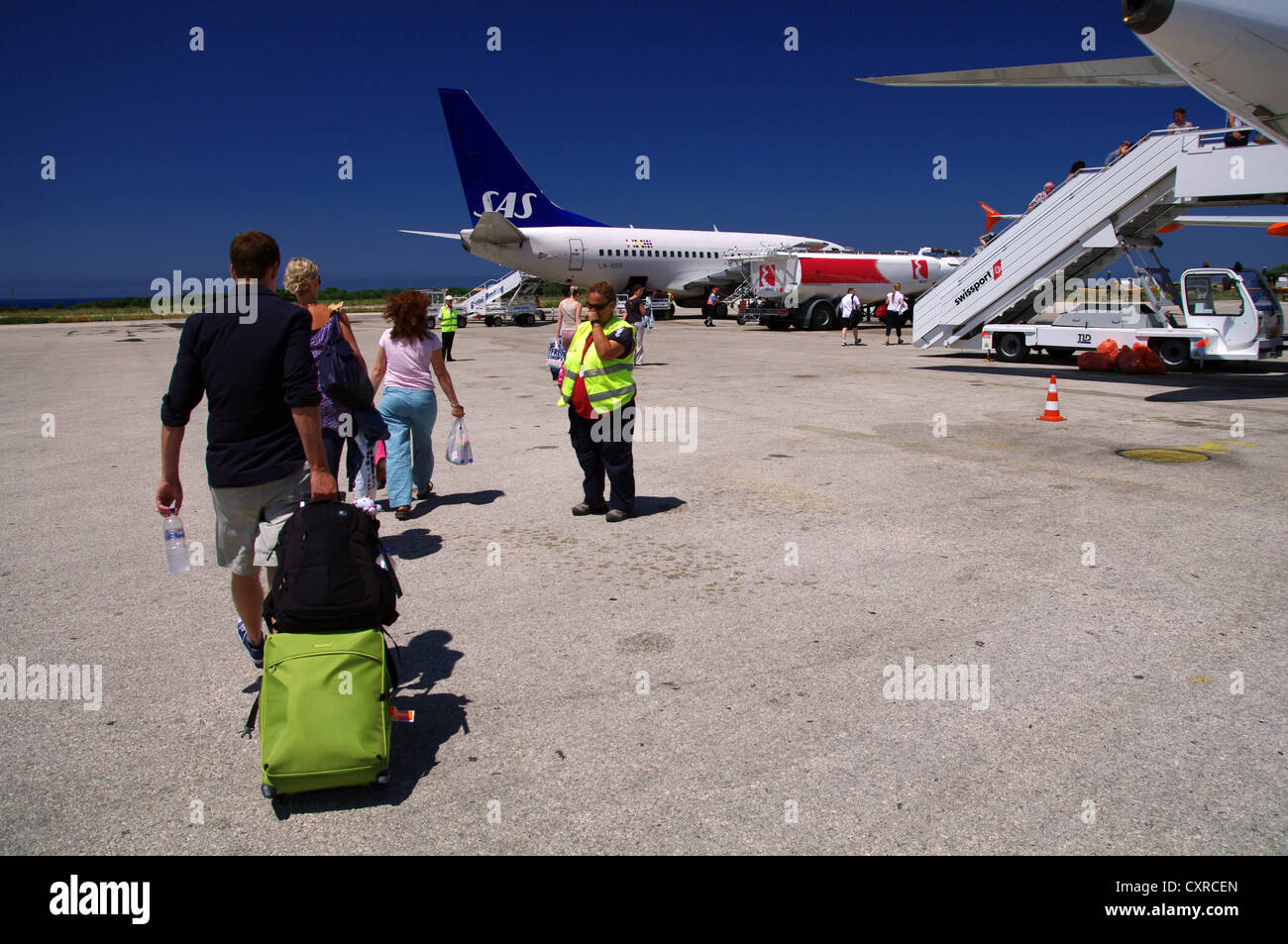 Holidaymakers boarding a flight in Cephalonia, Greece Stock Photo