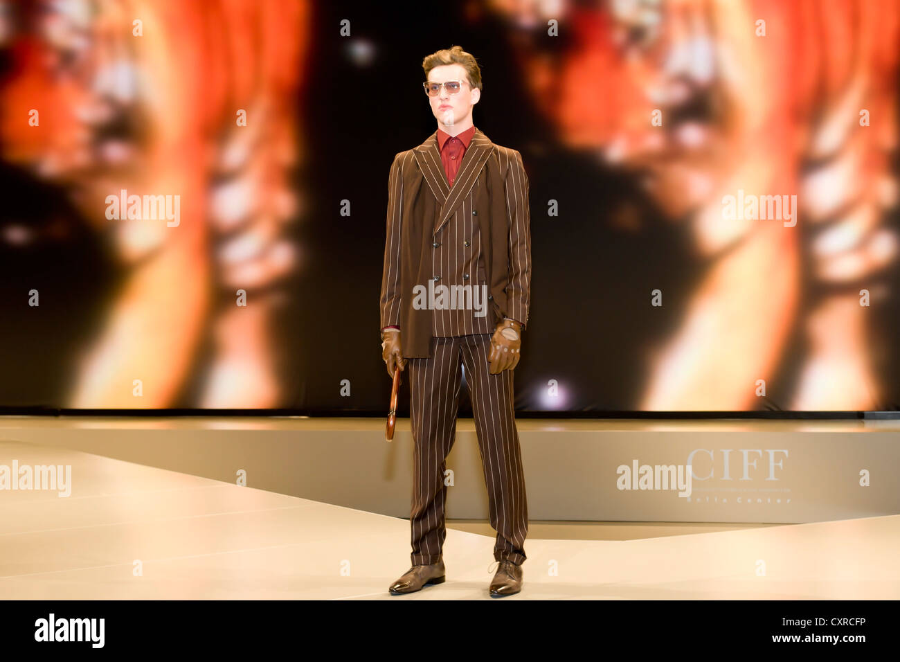 Young man presenting modern striped suit, Copenhagen International Fashion Fair, Copenhagen, Denmark, Europe Stock Photo