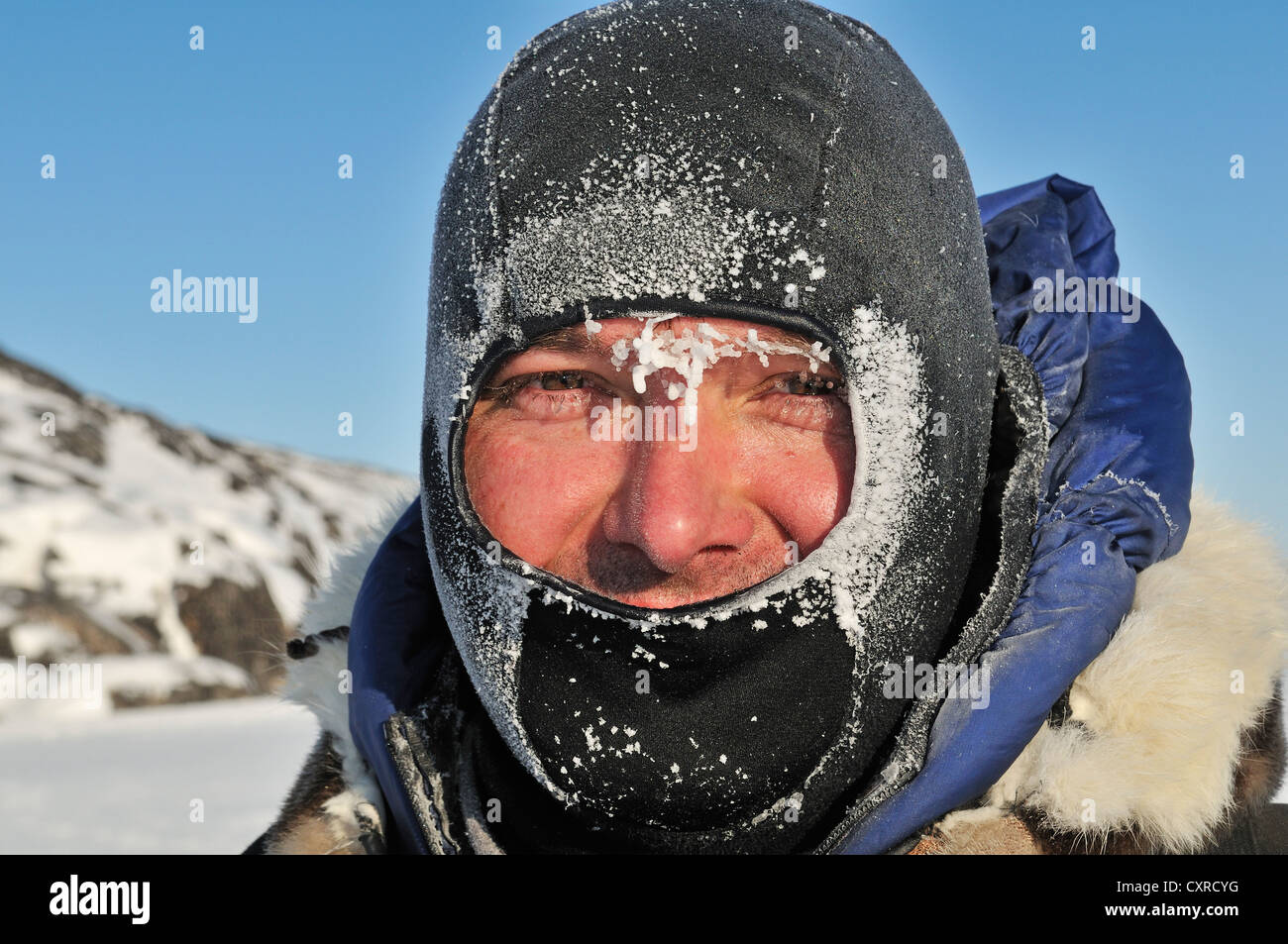 Man wearing a mask covered with ice, Greenland, Arctic North America Stock  Photo - Alamy