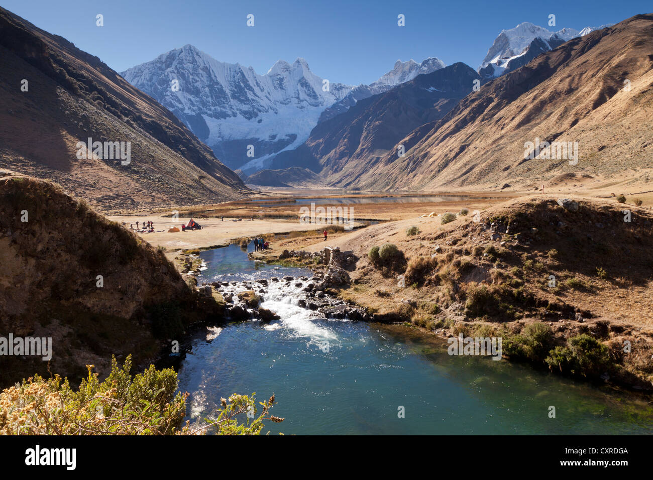 Rio Jahuacocha river at the lake Laguna Jahuacocha with the mountains