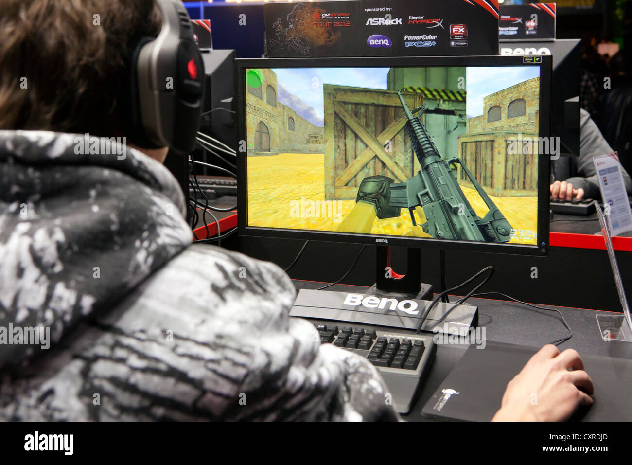 Teenager playing Counter Strike, a computer game, CeBIT international computer expo, Hannover, Lower Saxony, Germany, Europe Stock Photo