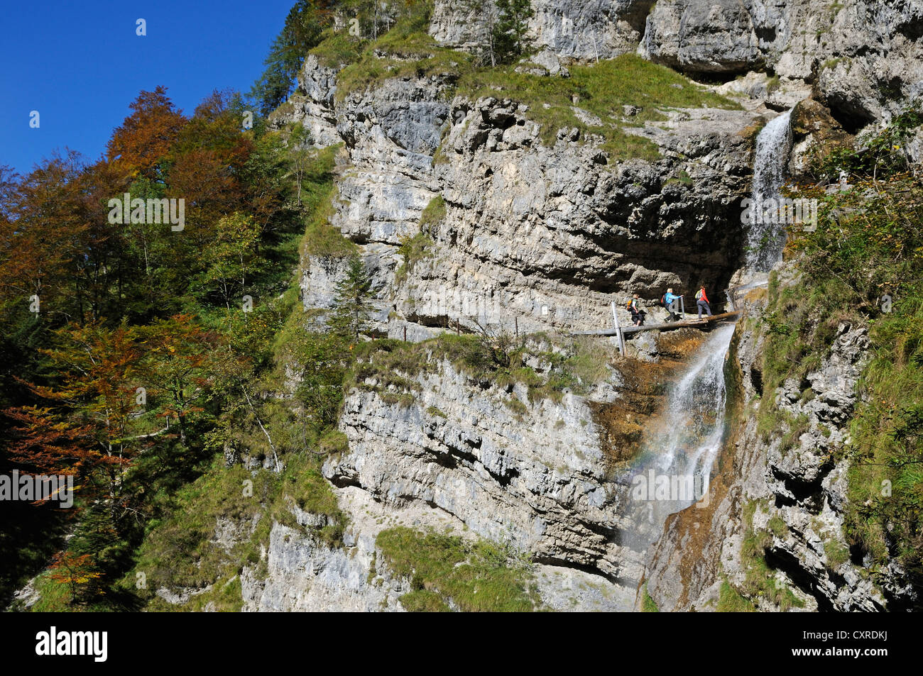 Female hikers at the Staubfall waterfall, Heutal valley, Unken, Tyrol, Austria, Europe Stock Photo