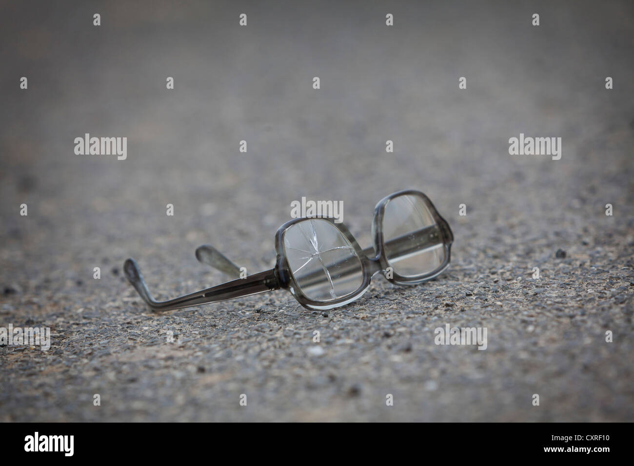 Old broken glasses lying in the street Stock Photo Alamy