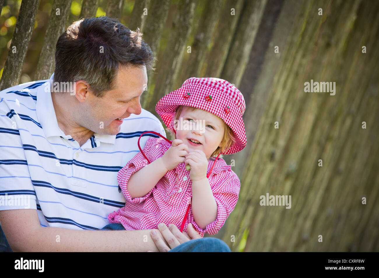Girl, one and a half years old, with her father Stock Photo Alamy
