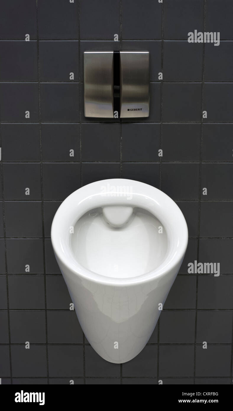 Urinal in a men's toilet, Olympiahalle multi-purpose arena, Munich, Bavaria, Germany, Europe Stock Photo