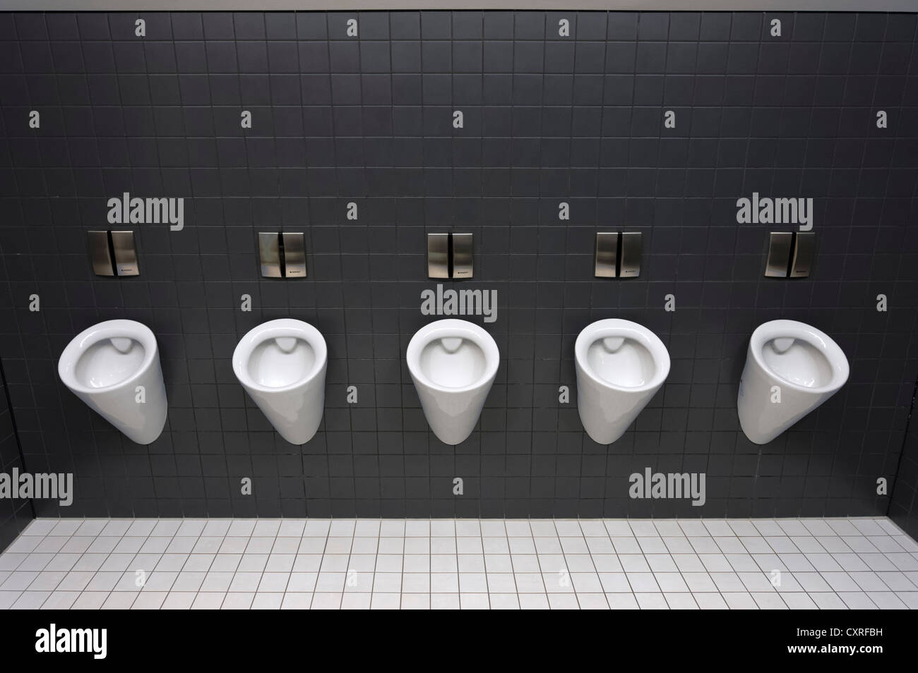 Urinals in a men's toilet, Olympiahalle multi-purpose arena, Munich, Bavaria, Germany, Europe Stock Photo