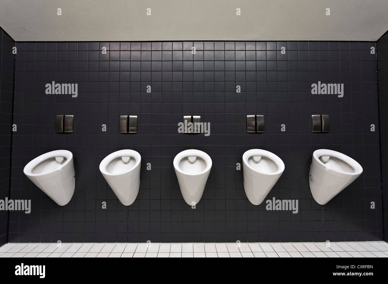 Urinals in a men's toilet, Olympiahalle multi-purpose arena, Munich, Bavaria, Germany, Europe Stock Photo