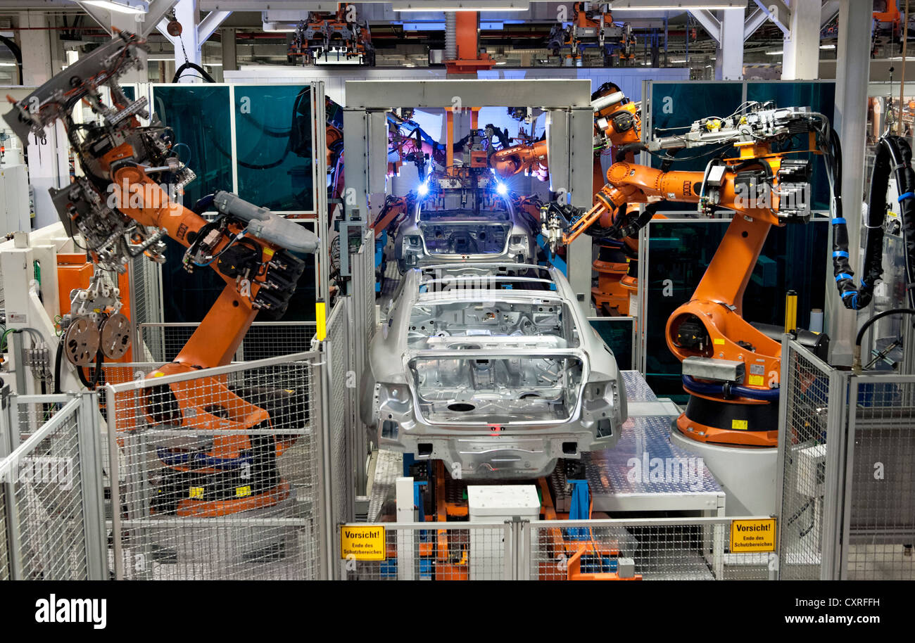Industrial robots soldering roof panels of Audi vehicles using Plasmatron, A4 Sedan, A4 Avant, A5 Coupe, A5 Sportback and RS5 Stock Photo
