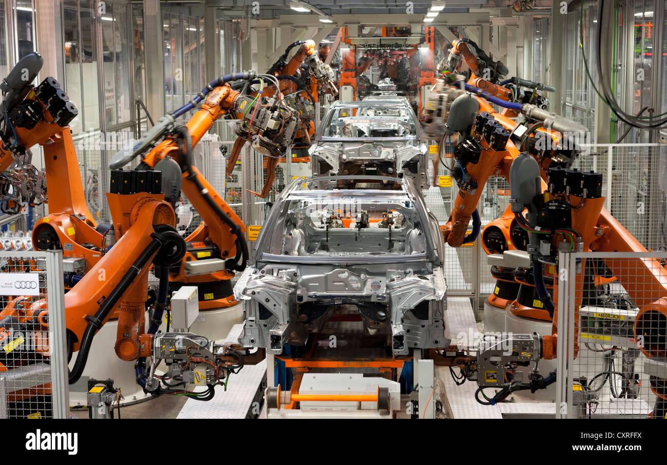 Industrial robots putting out car bodies on assembly line 2, Audi A4 Sedan, A4 Avant, A5 Coupe, A5 Sportback and RS5 Stock Photo