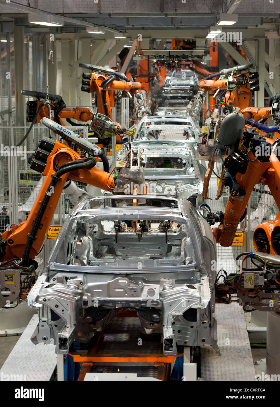 Industrial robots putting out car bodies on assembly line 2, Audi A4 Sedan, A4 Avant, A5 Coupe, A5 Sportback and RS5 Stock Photo