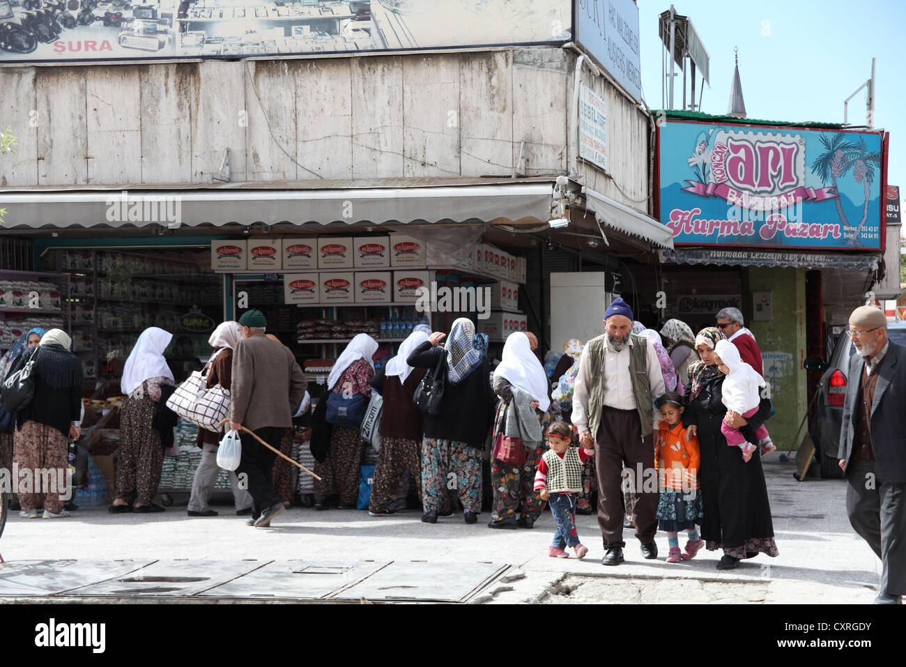 Street scene with shoppers at a sale in the old city of Konya Turkey Stock Photo